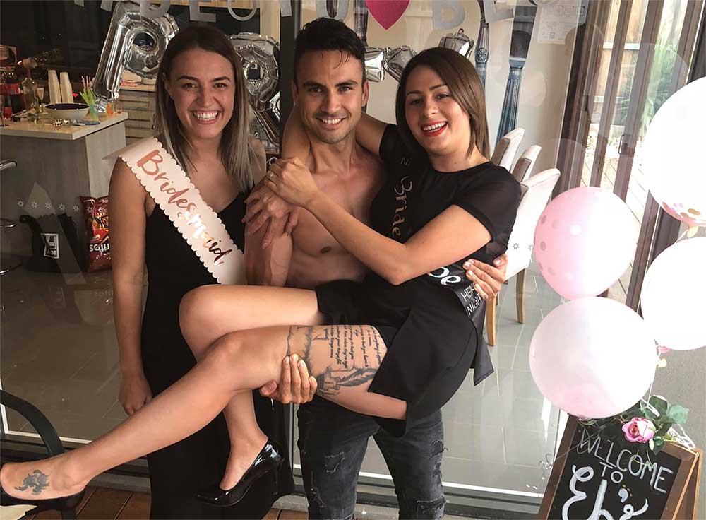 male topless waiters hosting event with girls